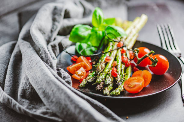 istock Grilled Asparagus with Cocktail Tomatoes 1302300768