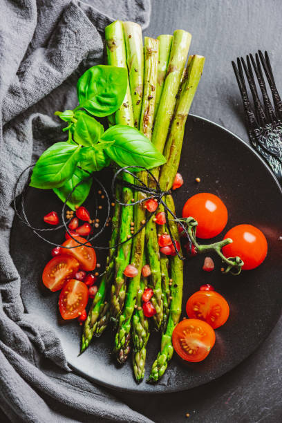 istock Grilled Asparagus with Cocktail Tomatoes 1302300868
