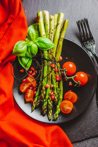 istock Grilled Asparagus with Cocktail Tomatoes 1302300877