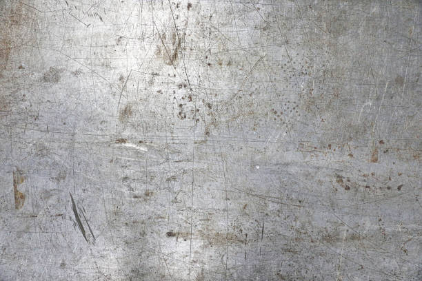 Textured background of old scratched, weathered metal surface Textured background of old scratched, weathered metal surface textured effect metal rusty textured stock pictures, royalty-free photos & images