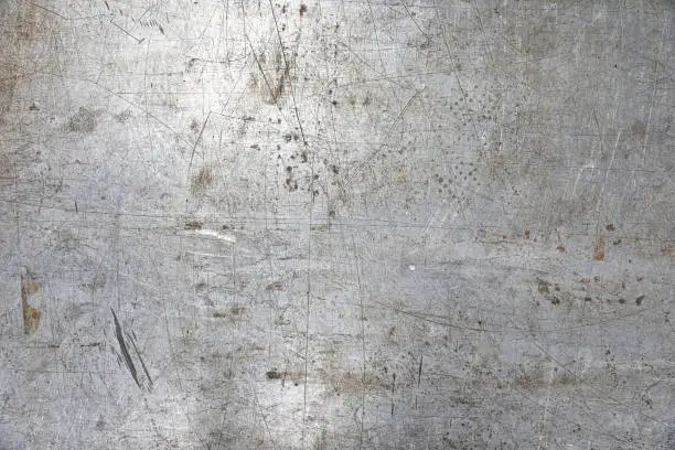 Photo of Textured background of old scratched, weathered metal surface