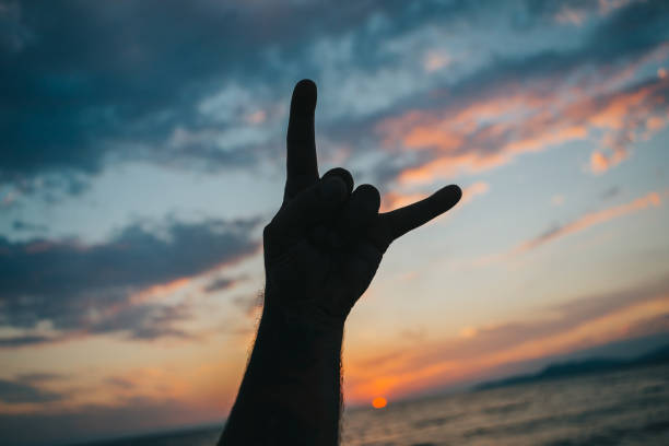 istock Sun goes down, metal heads come out 1302301094