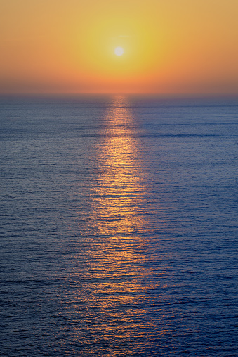 Shot of a sunset over the sea horizon