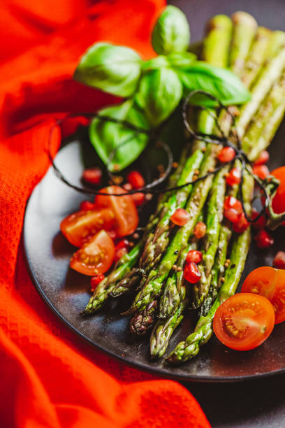 istock Grilled Asparagus with Cocktail Tomatoes 1302301179