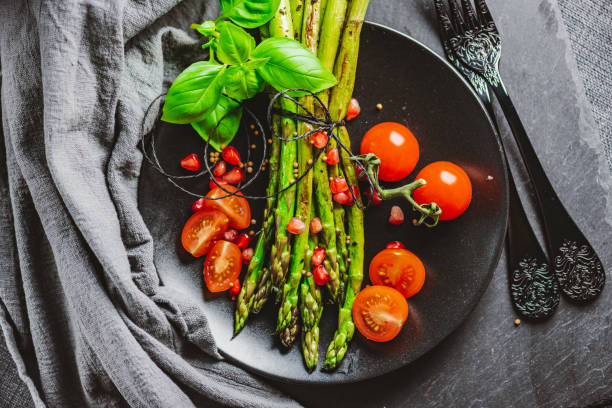 istock Grilled Asparagus with Cocktail Tomatoes 1302301286