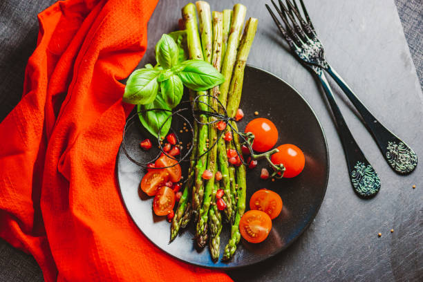 istock Grilled Asparagus with Cocktail Tomatoes 1302301433