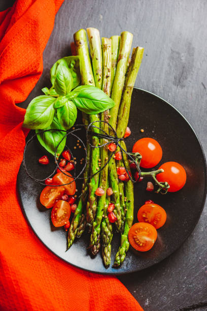 istock Grilled Asparagus with Cocktail Tomatoes 1302301479