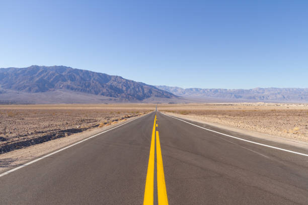 istock An empty road running straight through Death Valley 1302303812