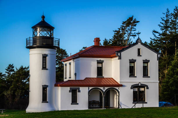 istock The admiralty Head Lighthouse with classic Pacific Northwest woods behind it 1302303815
