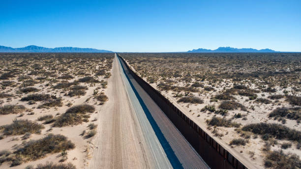 Drone View of the International Border Between Mexico and The United States Aerial View of the International Border Between Mexico and The USA. international border barrier stock pictures, royalty-free photos & images