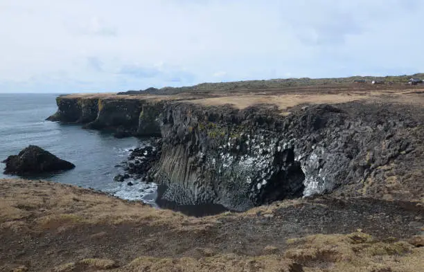 Stunning lava rock cliffs and basalt columns on the coast.