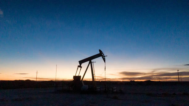 istock Pump Jack Near Carlsbad New Mexico at Sunset 1302303903