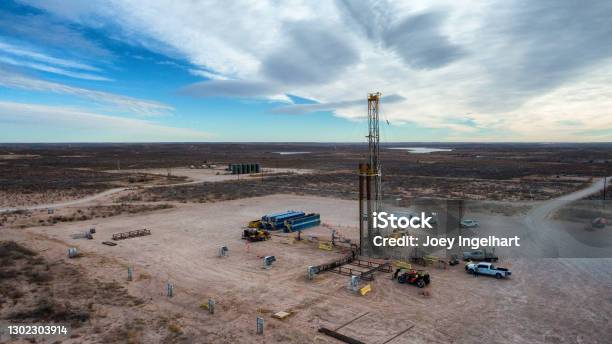 Drone View Of An Oil Or Gas Drill Fracking Rig Pad With Beautiful Cloud  Filled Sky Stock Photo - Download Image Now - iStock