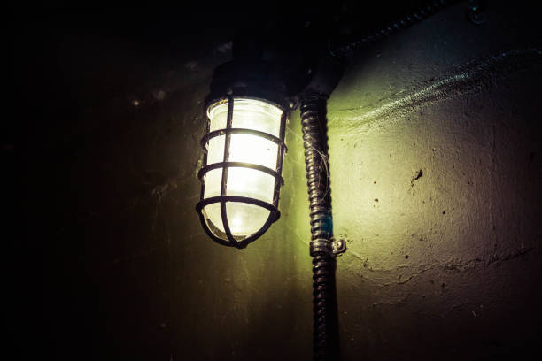 istock An old WWII era light illuminating the dark 1302303941