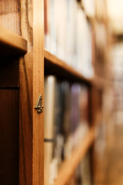 istock Focus on bookshelves of a public library. 1302304960