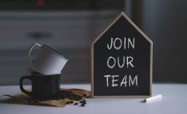 istock Join our team text on blank black chalkboard next to two cups and coffee beans. Copy space for text or artwork mockup 1302304977