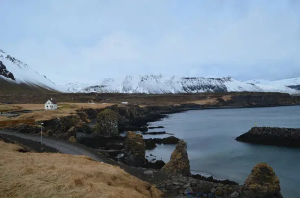 Beautiful quaint fishing village of Arnarstapi along the Icelandic coast.