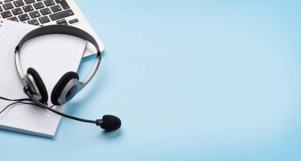istock Office desk with headset and laptop. Work from home 1302305414
