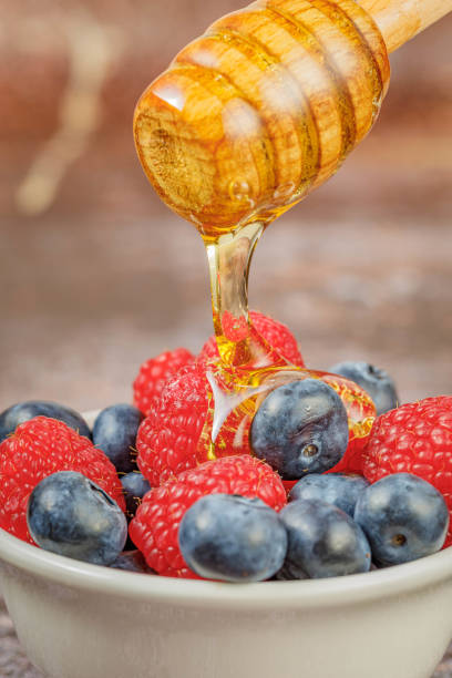 Fresh berries (blueberries and raspberries) with honey