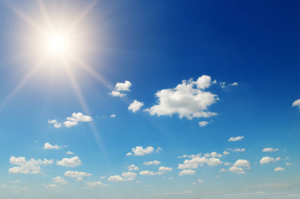 istock Strong sun, blue sky and cumulus clouds. 1302307516