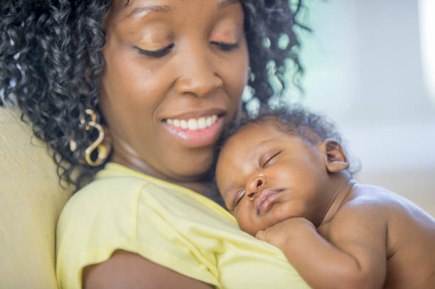 istock Newborn baby sleeping on mother's chest 1302307591