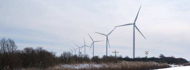 istock wind turbines and very small windmills in holland 1302308599