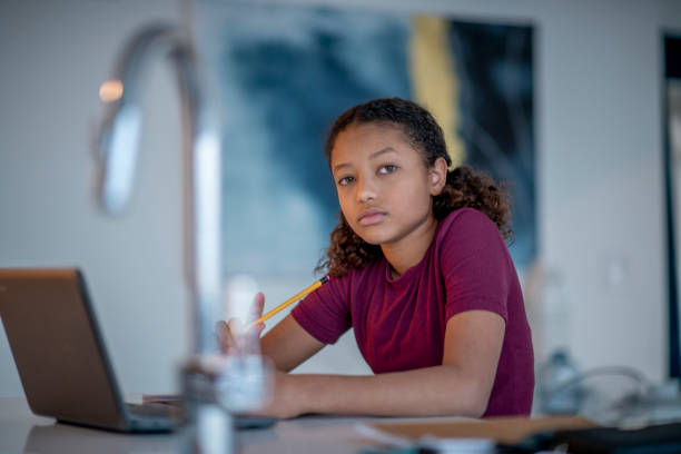 istock Young girl at home with her laptop 1302308697