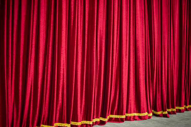 istock red closed theater curtain and stage. 1302309267