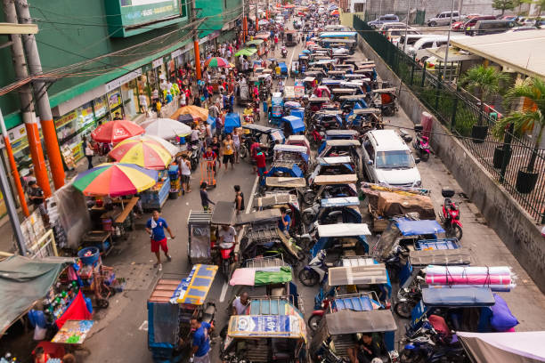 Tricycle motorbike parking in Chinatown in Manila, Philippines Manila, Philippines - September 24, 2018: Top view to the overcrowded tricycle motorbike parking in Chinatown in Manila city, Philippines. philippines tricycle stock pictures, royalty-free photos & images