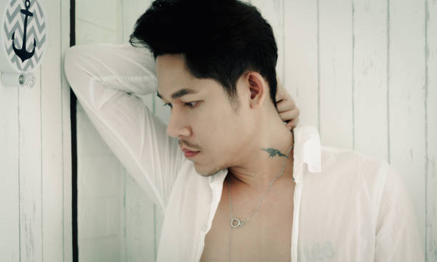 istock Young Asian handsome man standing looking away 1302311778