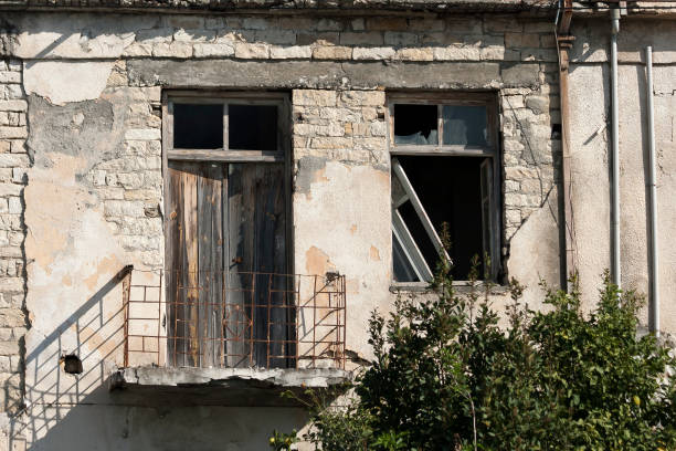 istock Old brick house wall with door and window 1302311849