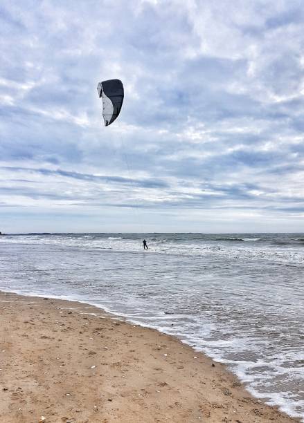 istock Kitesurfing at the beach 1302314666