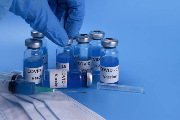 istock coronavirus vaccine injection. COVID-19 vaccination concept 1302315712