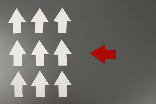 istock Leadership concept with red arrow leading 1302315857