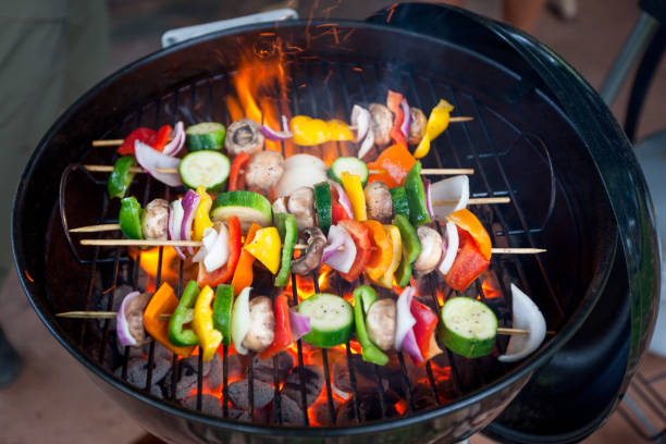 istock Vegetable Skewers Cooking on a Barbecue Grill 1302316151