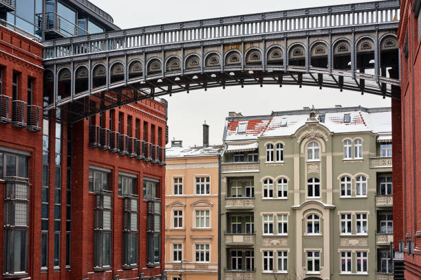 istock metal footbridge and Red brick wall in an old brewery 1302316270