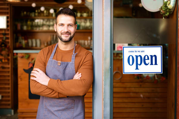 istock Small cafe owner man standing in cafe door 1302318201