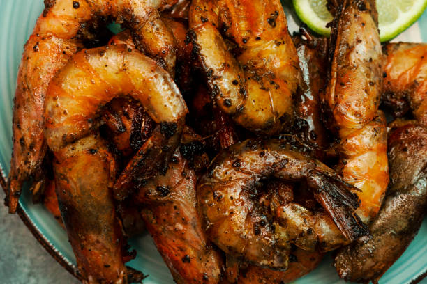 istock Delicious roasted grilled shrimps background 1302318306