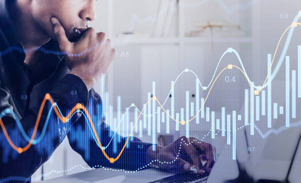 istock Serious African man in office and graphs 1302319117