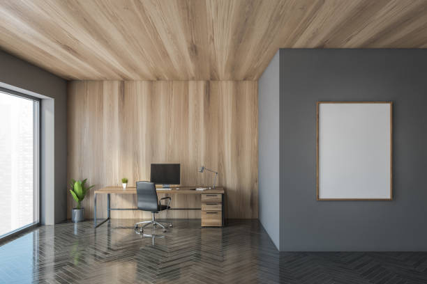 istock Gray and wooden CEO office interior with poster 1302320310