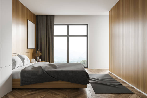 istock White and wooden bedroom corner with poster, side view 1302320507