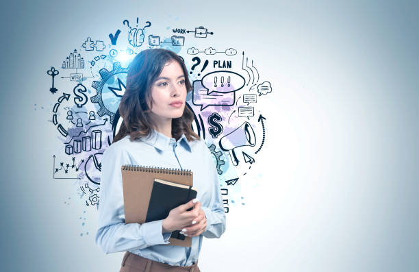 istock Woman with notebook and her business plan 1302320970