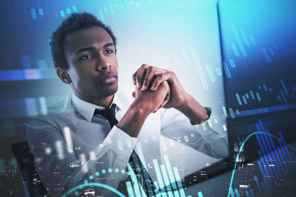 istock African man in office and graphs 1302321620
