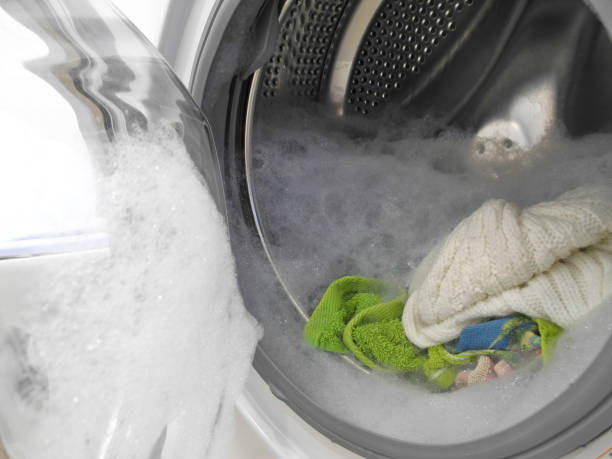 istock Excessive foam in washing machine 1302324750
