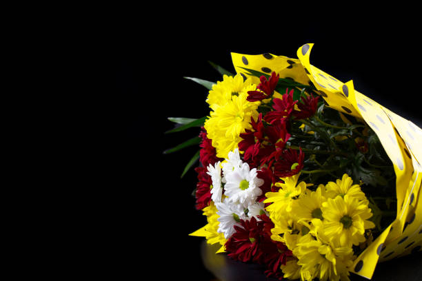 istock Bouquet isolated on black. Yellow chrysanthemums with copy space 1302324773
