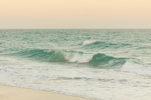 Pastel Sunset Over Teal Ocean Waves on the Shoreline of Palm Beach, Florida