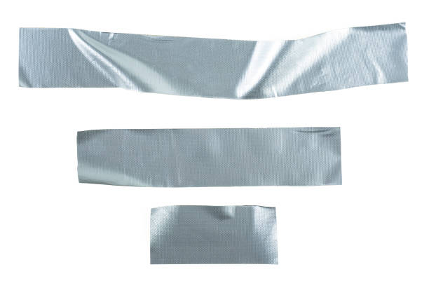 istock Set pieces of silver self-adhesive construction tape isolated on a white background. Metallic reinforced tape. 1302326075