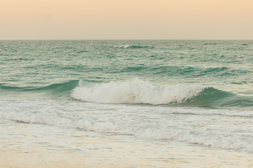 Pastel Sunset Over Teal Ocean Waves on the Shoreline of Palm Beach, Florida