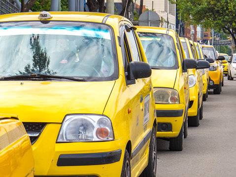 Taxis in line waiting for passengers in some street of Bogota - Colombia. February 15/2021