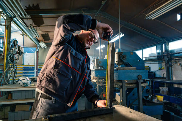 istock The handyman measuring the bar in the workshop 1302330664